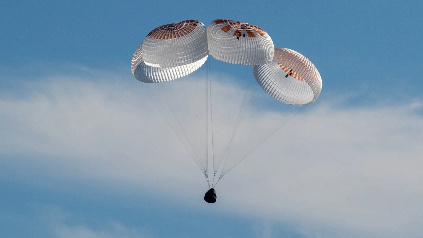 Spacecraft returning to earth, slowed down by