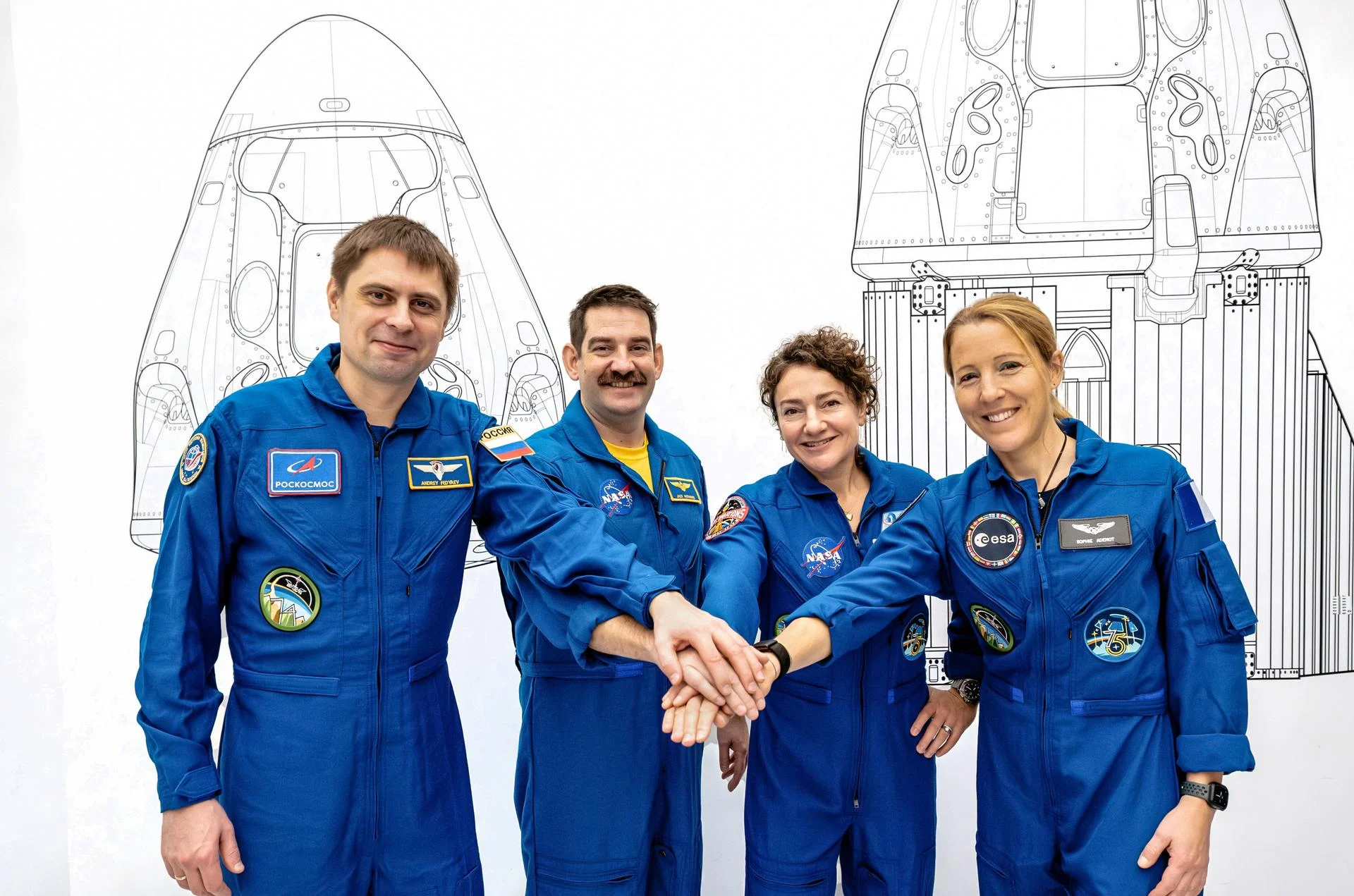 The four members of NASA's SpaceX Crew-12 mission to the International Space Station pose together for a crew portrait in their blue flight suits at SpaceX headquarters in Hawthorne, California. From left are, Roscosmos cosmonaut and Mission Specialist Andrey Fedyaev, NASA astronauts Jack Hathaway and Jessica Meir, Pilot and Commander respectively, and ESA (European Space Agency) astronaut and Mission Specialist Sophie Adenot.